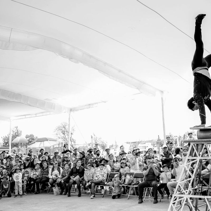 Man in a deep squat, showing balance and control.